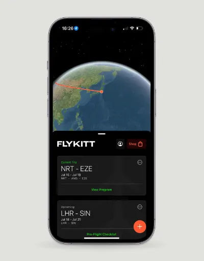 Smartphone displaying the FlyKitt app with flight paths and travel program details.